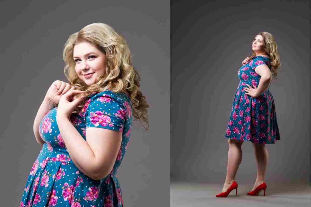 Plus size fashion model in floral dress, fat woman on gray background