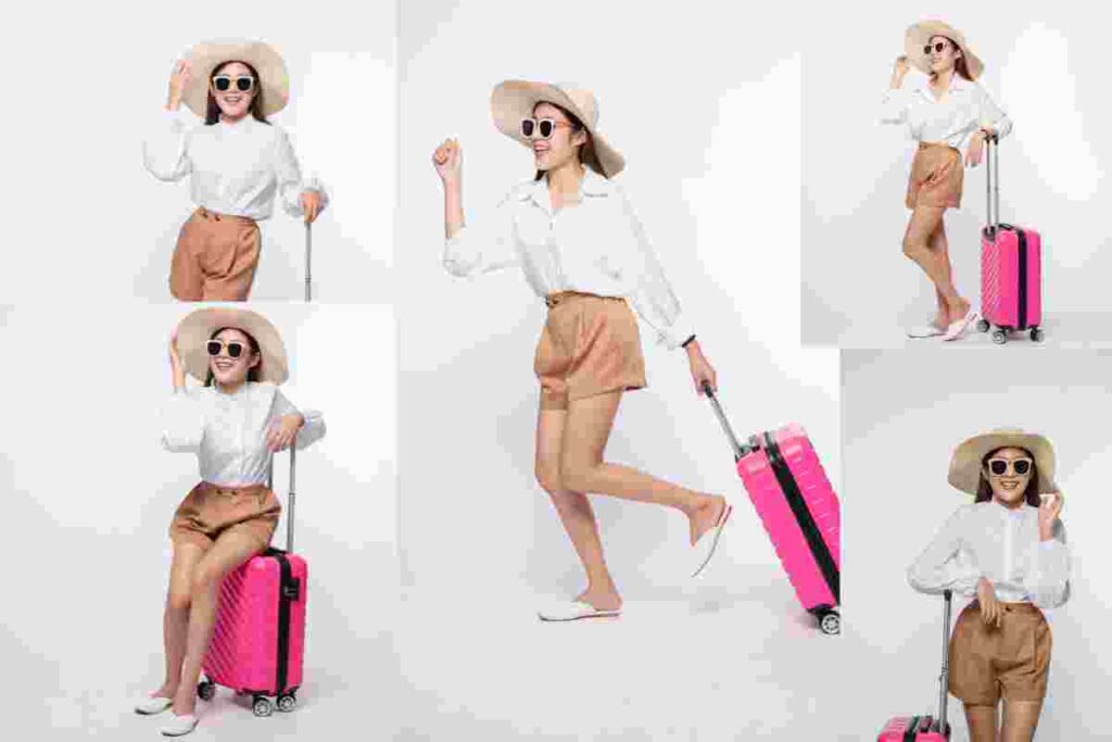 Woman wearing a hat, glasses, and handles of suitcases to travel (1)